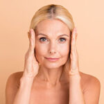 Photo of beauty uplift concept aged lady naked shoulders touch eye line uplift tightening