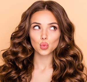 Close-up portrait of her she nice-looking attractive sweet gorgeous girlish curious wavy-haired girl looking aside sending kiss pout lips